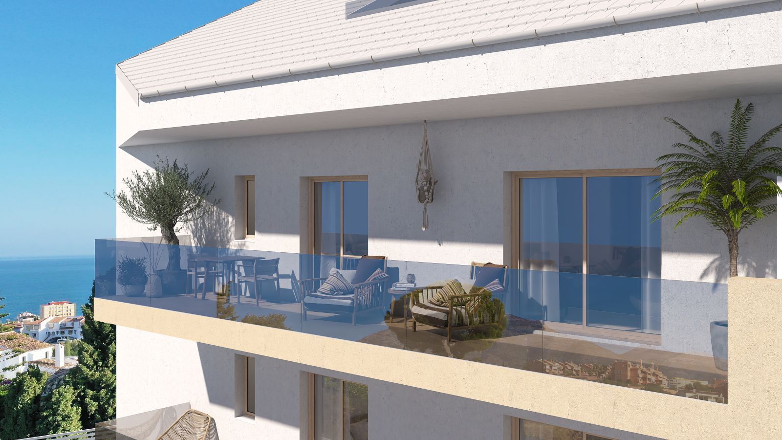 Balcony with sea view, outdoor furniture, plants, and glass railing.
